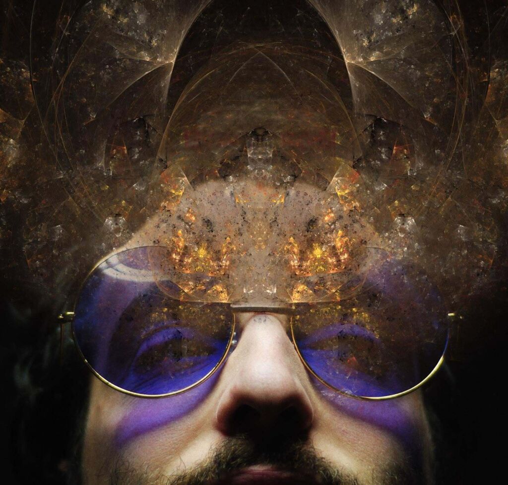 Close-up self-portrait of a person's nose and mouth partially obscured by round tinted glasses reflecting purple light, with an abstract fractal pattern overlaid above.